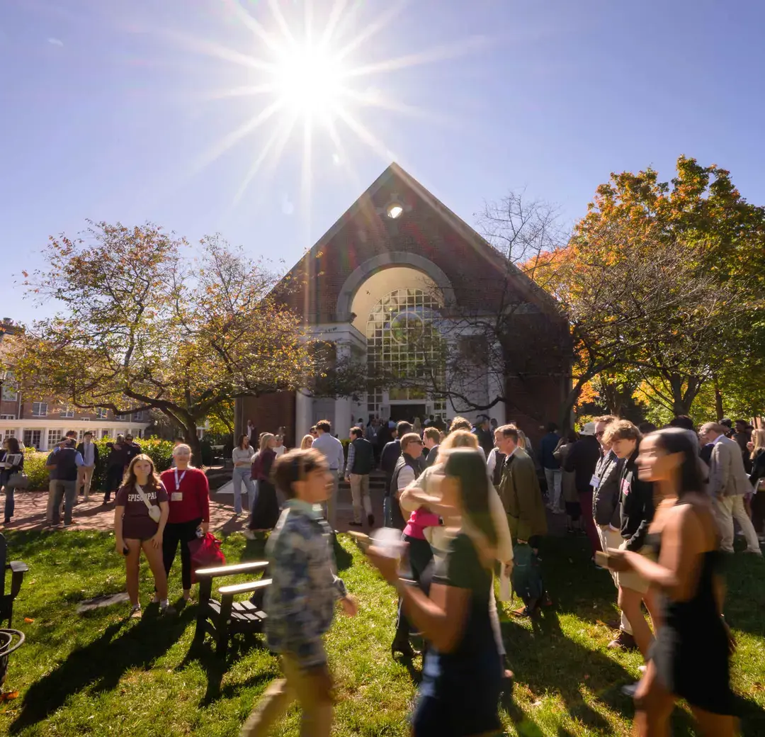 A vibrant gathering of students, faculty, and families outside Callaway Chapel on a sunny day, highlighting the strong sense of community at Episcopal High School.